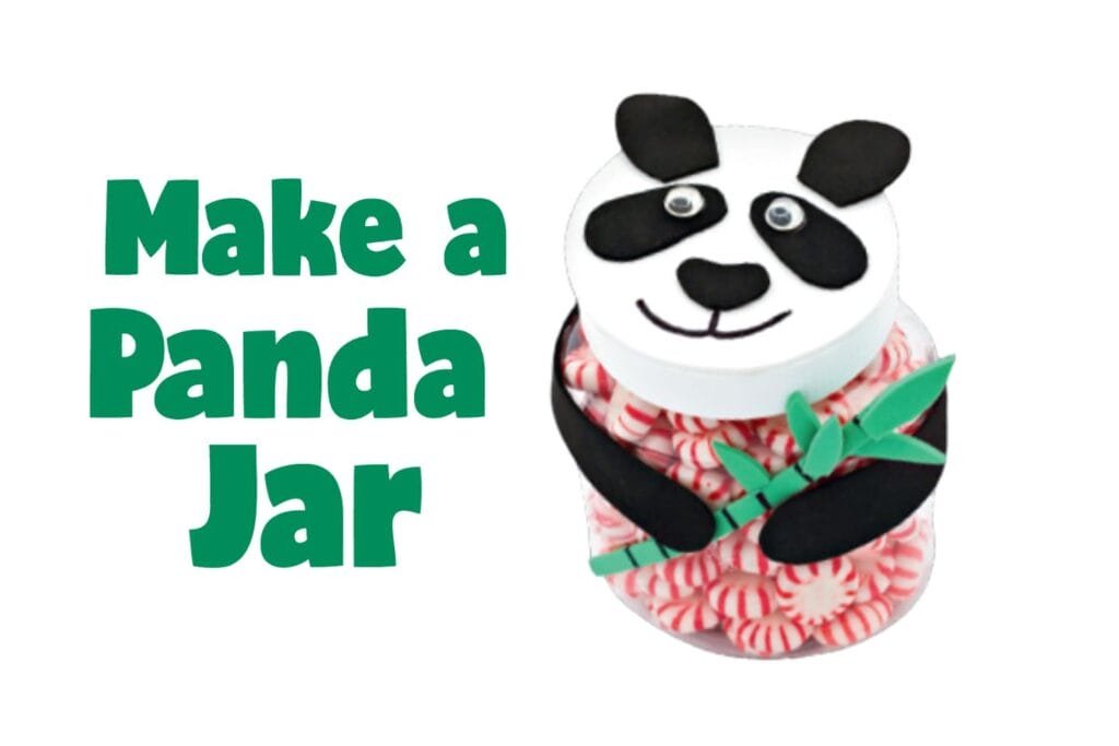 Handmade panda candy jar with black felt ears and bamboo filled with pink heart candies