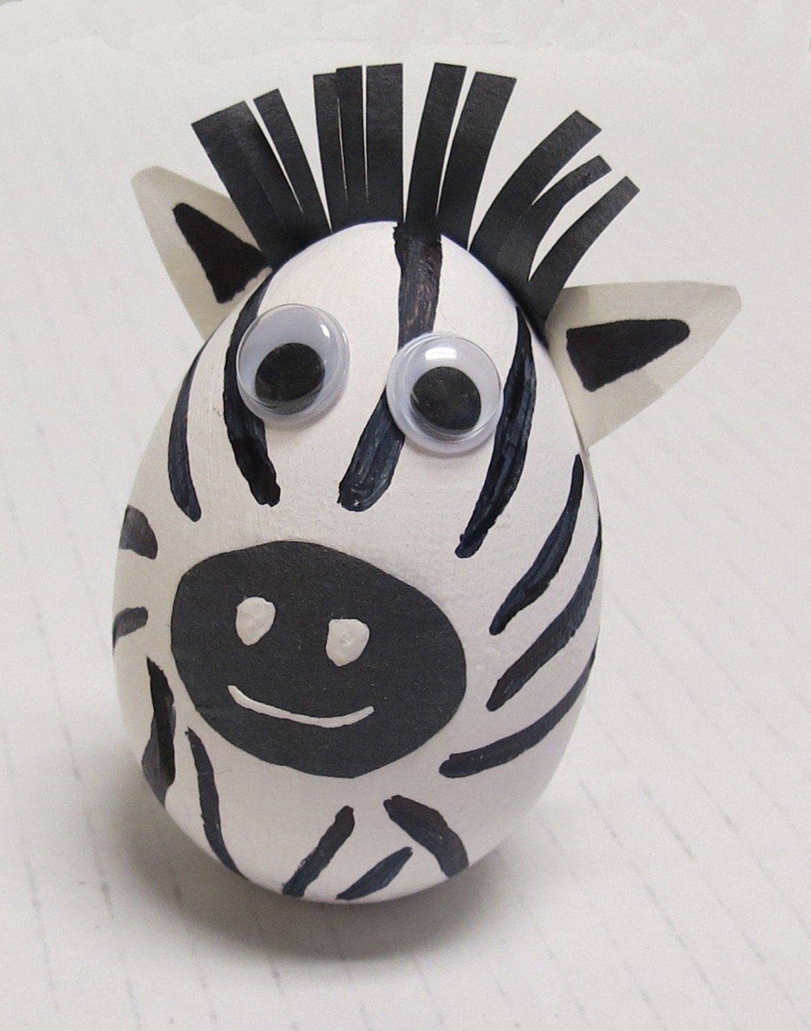 Painted wooden egg zebra with black stripes googly eyes and paper mane and ears