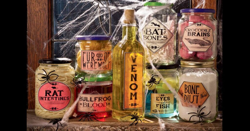 Halloween specimen jars on windowsill with labels like Rat Intestines Venom Bat Bones and Chicken Brains