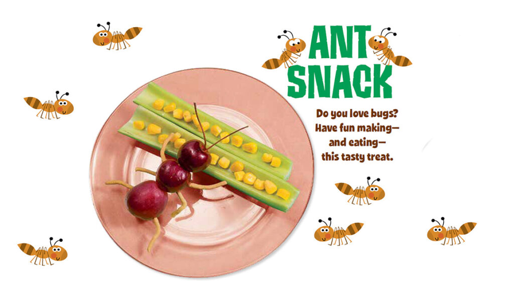 Fun ant snack made from cherries, celery sticks, and corn kernels on a pink plate