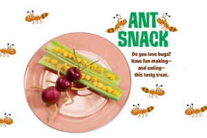 Fun ant snack made from cherries, celery sticks, and corn kernels on a pink plate
