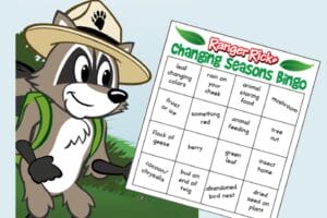 Ranger Rick Raccoon holding a nature bingo card