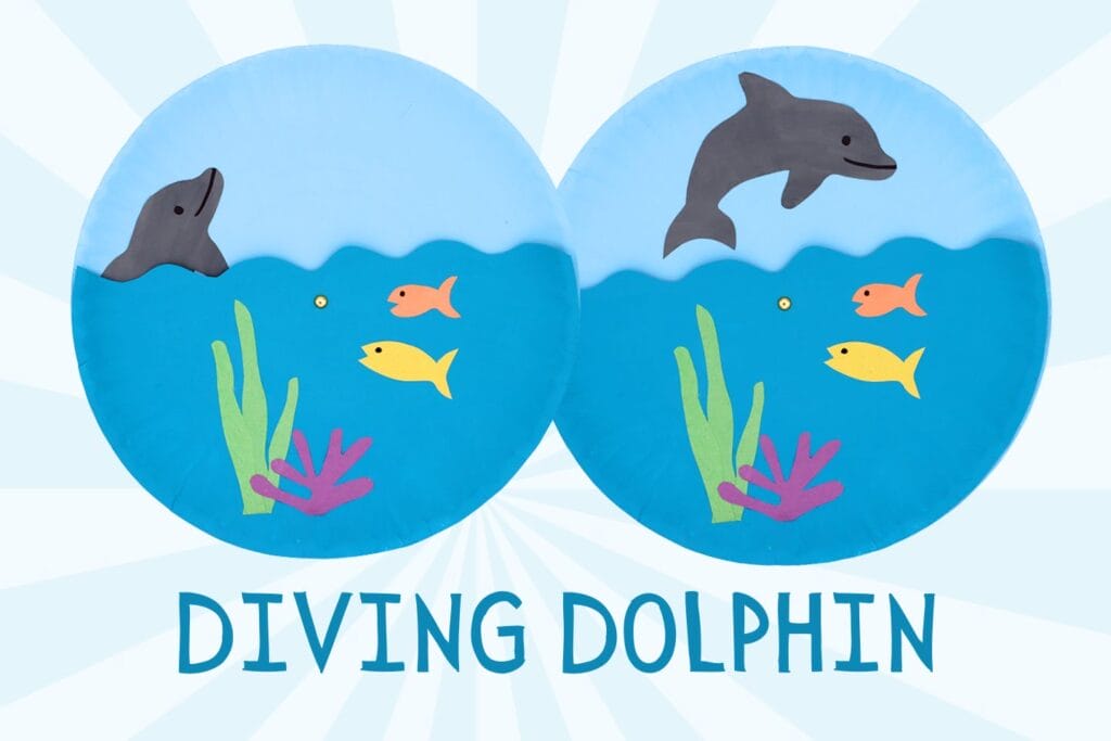 side-by-side views of a children's paper plate craft featuring a gray dolphin diving into blue ocean water above colorful fish, seaweed, and coral. The finished craft is labeled "Diving Dolphin."