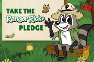 Ranger Rick waving and sitting on a log with the words "Take the Ranger Rick Pledge"